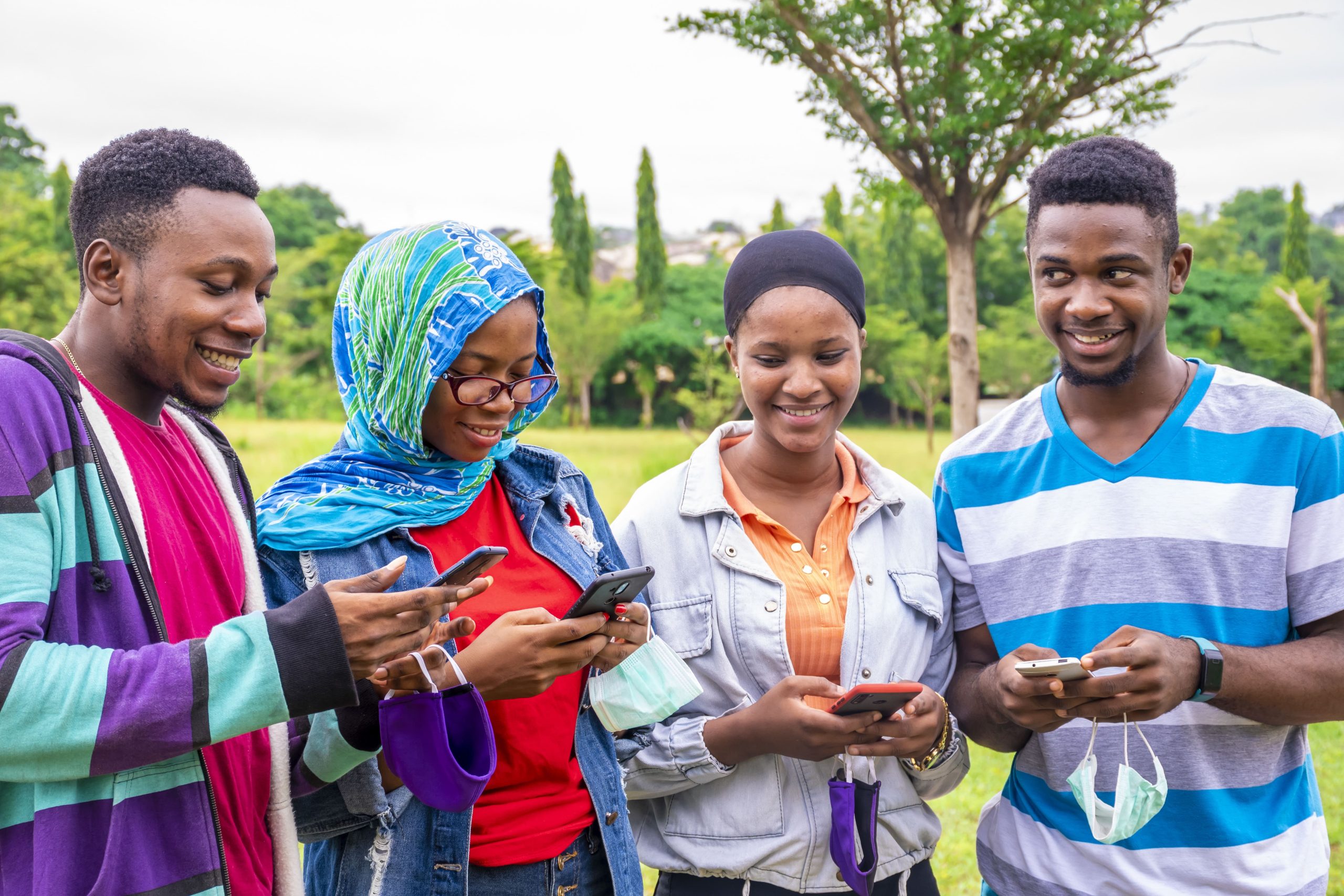 group-young-african-friends-with-facemasks-using-their-phones-park (1) Community wifi project